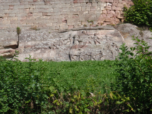 stone carvings that appear to be dinner, feast, or festival oriented.